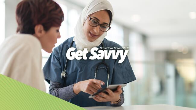 Female medical professional reviewing information with a patient.